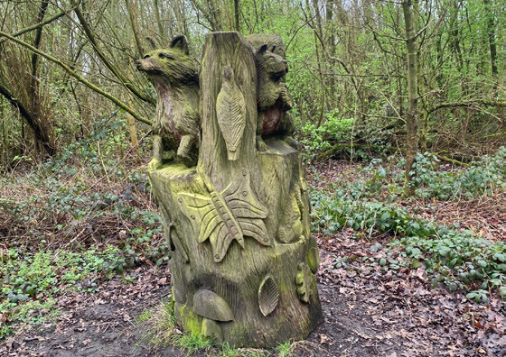 Precedent image showing how sculptures can provide play features within the landscape (wooden sculpture shown)