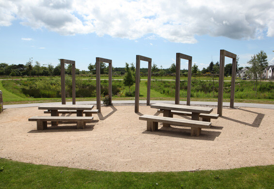 Precedent image showing benches and pergolas to support pop-up events at village green locations