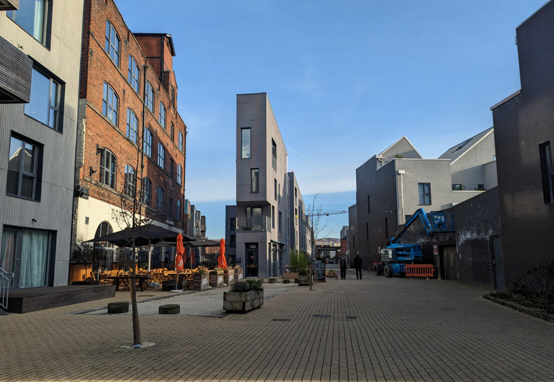 Precedent image showing cafes at ground floor with spill out space