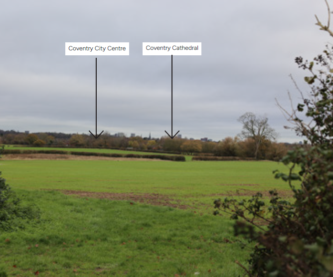 A wide green field that shows Coventry City Centre and Coventry Cathedral, indicated by labels and arrows pointing to the horizon.