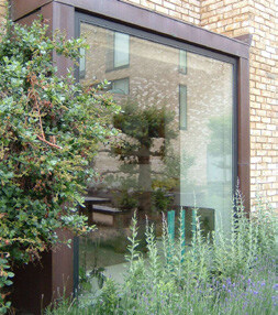Photo of a modern extension with floor-to-ceiling windows.